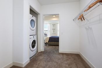 A laundry room with a washer and dryer in it.